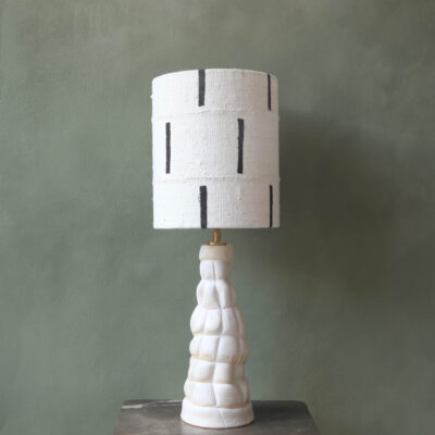 Sculptural ceramic lambs with mudcloth lampshade