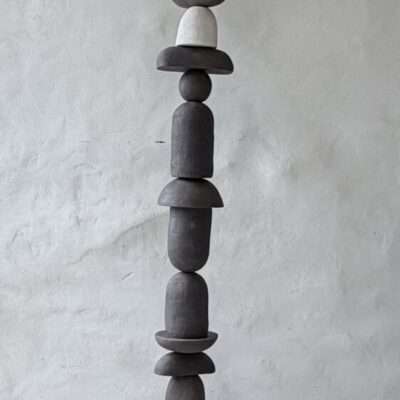 Vertical totem sculpture in black