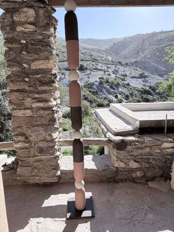 Vertical sculpture in red, black and white